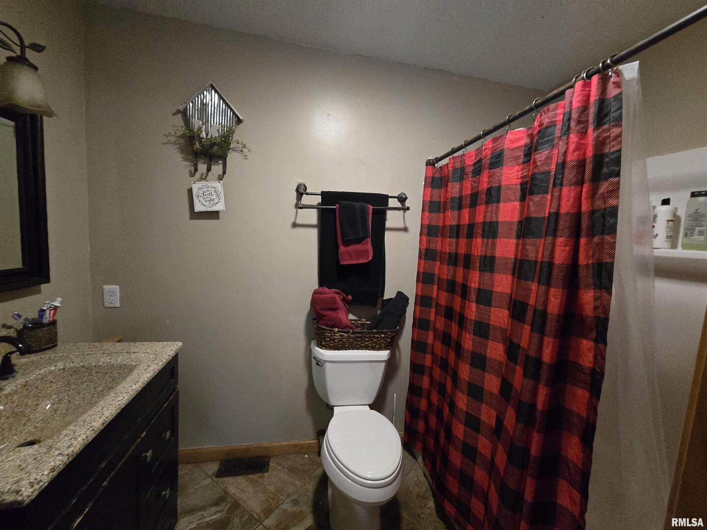 11882 Goshen Meadows Mount Vernon, IL 62864 - Photo 44 of 52 a bathroom with a toilet a sink and a mirror