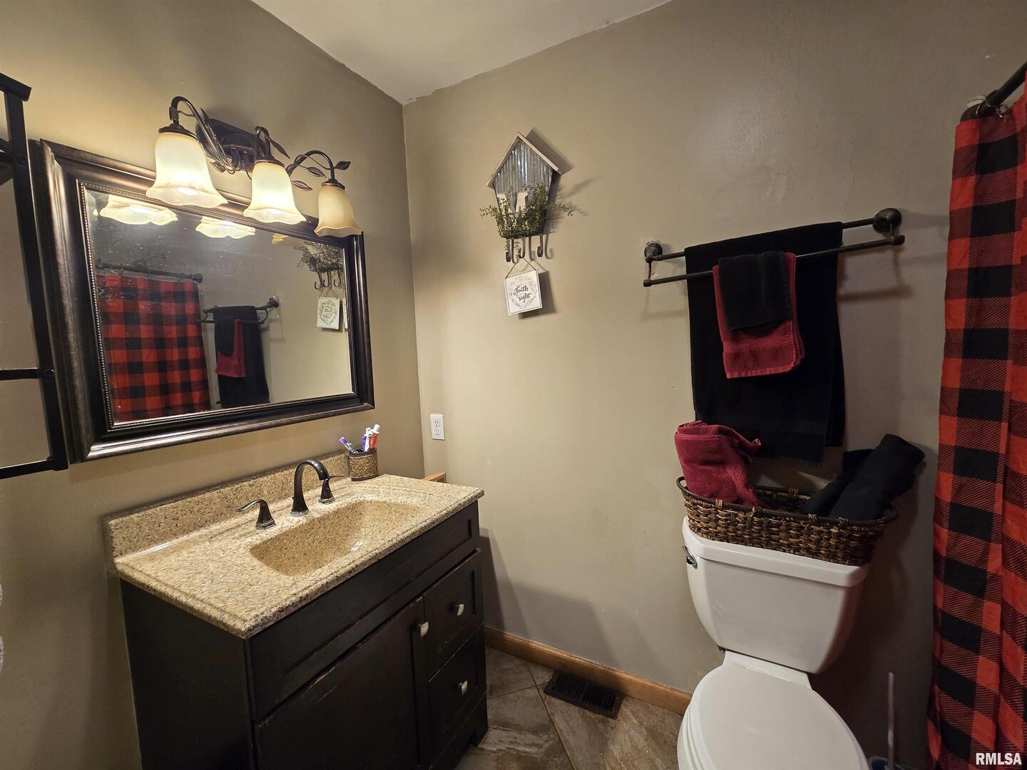 11882 Goshen Meadows Mount Vernon, IL 62864 - Photo 45 of 52 a bathroom with a sink vanity mirror and toilet