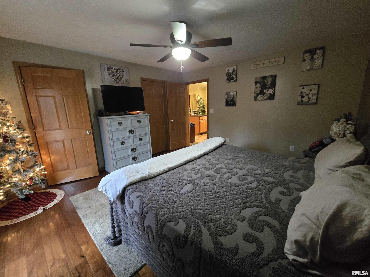 11882 Goshen Meadows Mount Vernon, IL 62864 - Photo 47 of 52 a bedroom with a bed and a flat tv screen on dresser