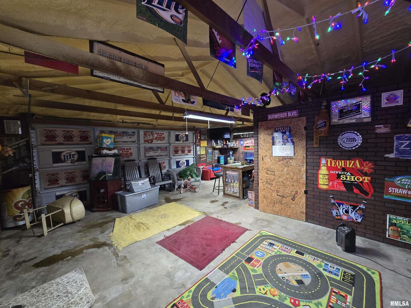 11882 Goshen Meadows Mount Vernon, IL 62864 - Photo 52 of 52 a room with lots of furniture and a flat screen tv