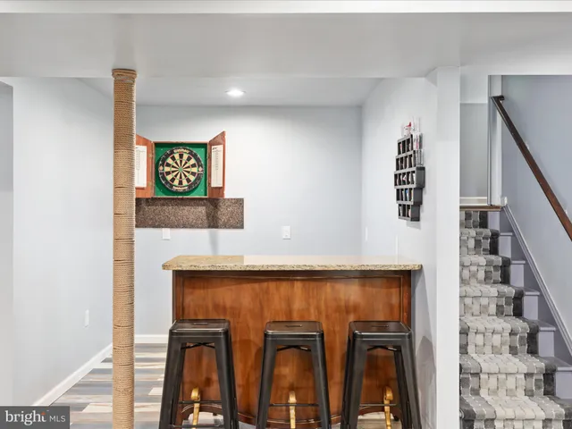 a view of a backyard with sitting area