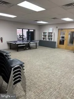 a view of empty room with a fireplace