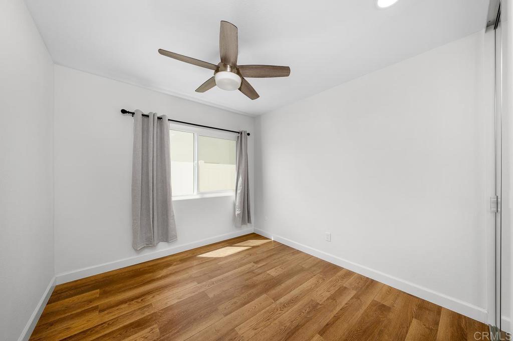 10315 Molino Road Santee, CA 92071 - Photo 13 of 19 a view of empty room with wooden floor and fan