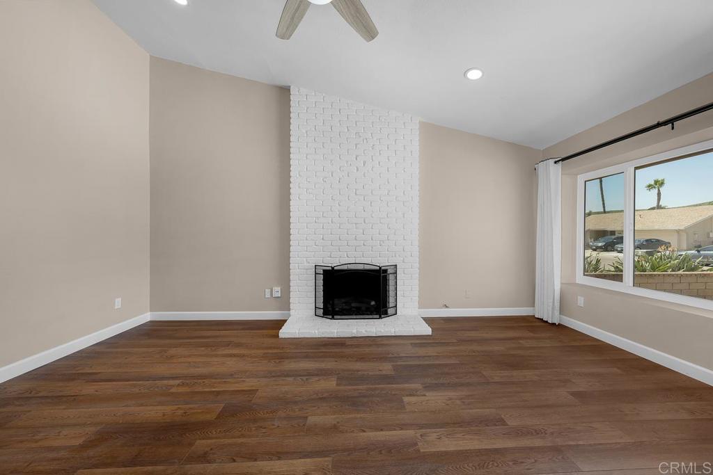 10315 Molino Road Santee, CA 92071 - Photo 3 of 19 a view of an empty room with wooden floor and a window