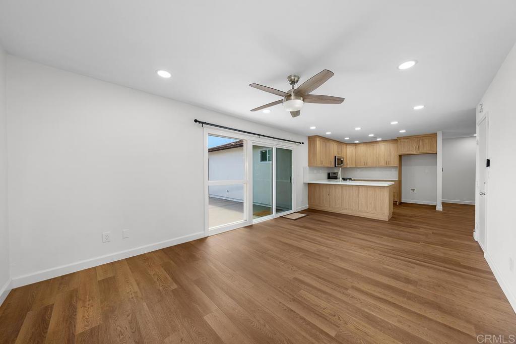 10315 Molino Road Santee, CA 92071 - Photo 7 of 19 a view of a kitchen with a sink and a refrigerator