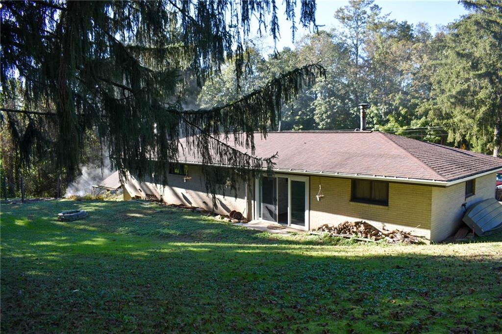 1039 Smithfield Road Smithfield, PA 15478 - Photo 2 of 16 a view of a house with a yard