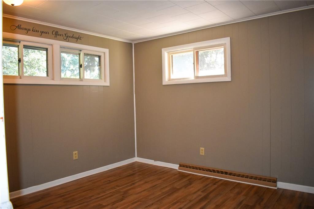 1039 Smithfield Road Smithfield, PA 15478 - Photo 12 of 16 an empty room with wooden floor and windows