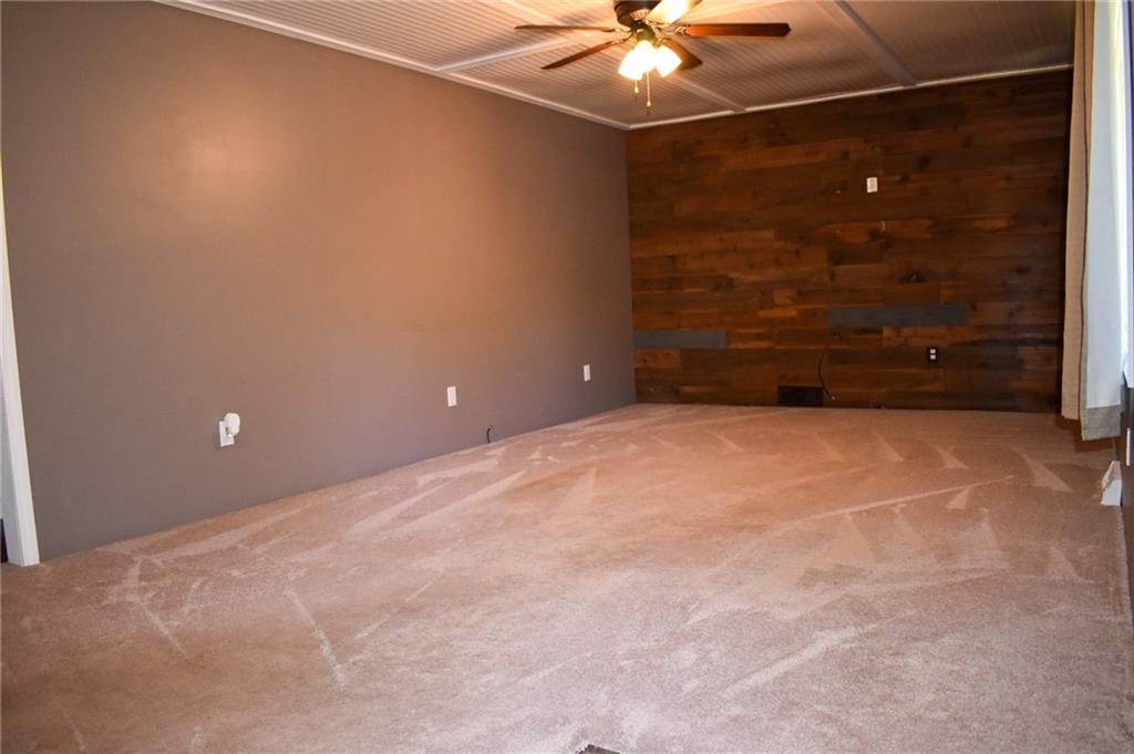 1039 Smithfield Road Smithfield, PA 15478 - Photo 5 of 16 a view of an empty room with a chandelier fan