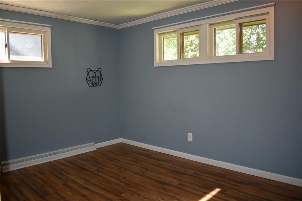 1039 Smithfield Road Smithfield, PA 15478 - Photo 10 of 16 wooden floor in an empty room with a window