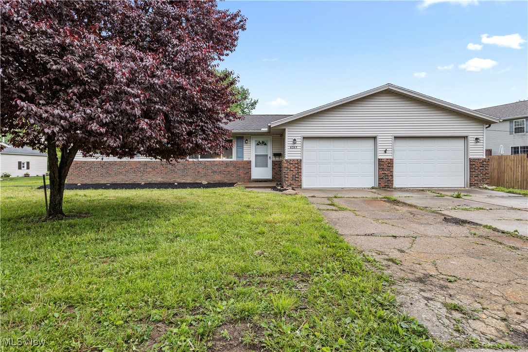 6265 Jaycox Road North Ridgeville, OH 44039 - Photo 1 of 39 Ranch-style house featuring brick siding, concrete driveway, and a garage
