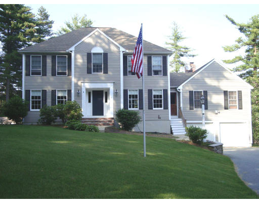 4 Fosters Pond Road Andover, MA 01810 - Photo 1 of 1 a front view of a house with a yard