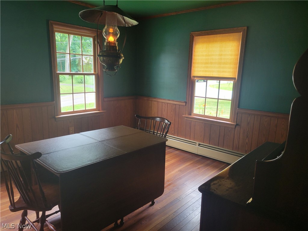 7357 Westview Road Kent, OH 44240 - Photo 13 of 30 Dining room with wood-type flooring, a baseboard radiator, and a wealth of natural light