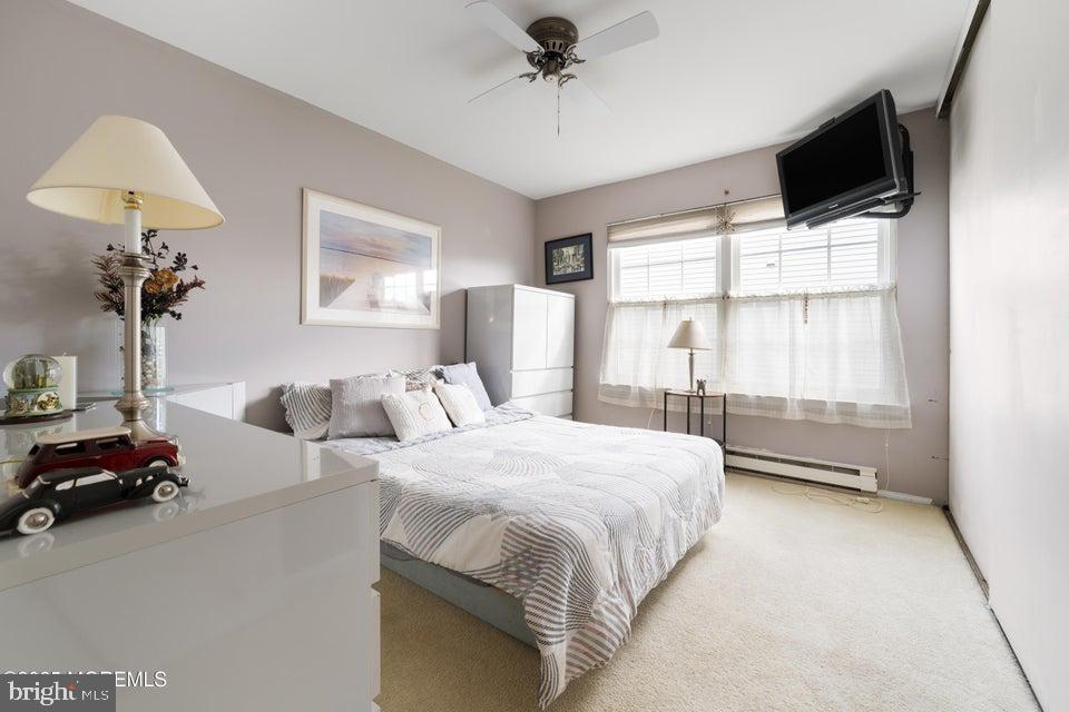 73 Red Hill Road Manchester Township, NJ 08759 - Photo 18 of 25 a bedroom with a bed and a chandelier