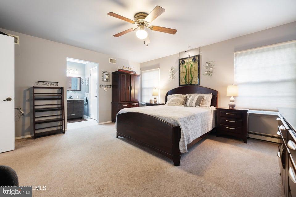 73 Red Hill Road Manchester Township, NJ 08759 - Photo 19 of 25 a bedroom with a bed and a chandelier