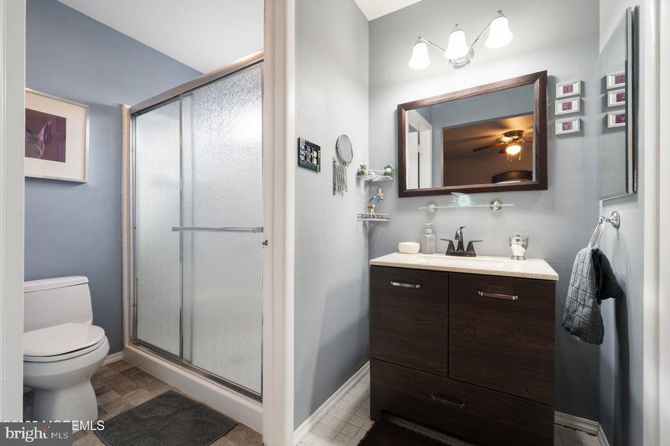 73 Red Hill Road Manchester Township, NJ 08759 - Photo 22 of 25 a bathroom with a toilet sink and mirror