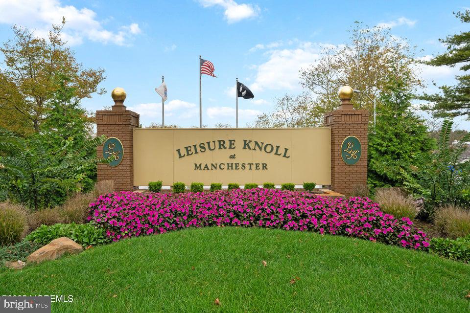73 Red Hill Road Manchester Township, NJ 08759 - Photo 3 of 25 a sign board with a big yard and potted plants