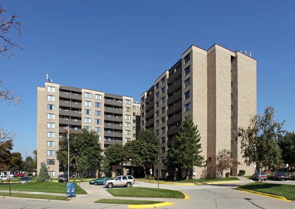 6120 Middlebelt Road Garden City, MI 48135 - Photo 1 of 7 a front view of multi story residential apartment building with yard and trees