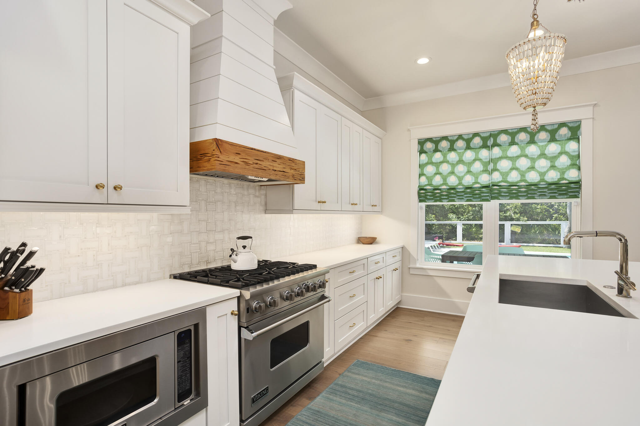 60 Blue Lake Road Santa Rosa Beach, FL 32459 - Photo 17 of 39 a kitchen that has a sink and a stove