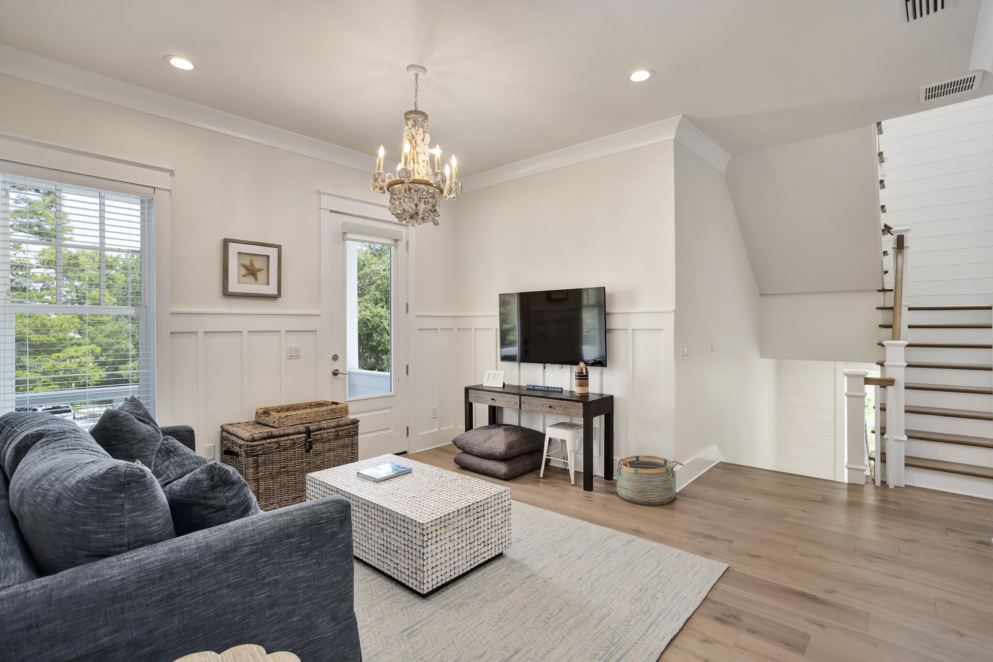60 Blue Lake Road Santa Rosa Beach, FL 32459 - Photo 28 of 39 a living room with furniture a flat screen tv and a large window
