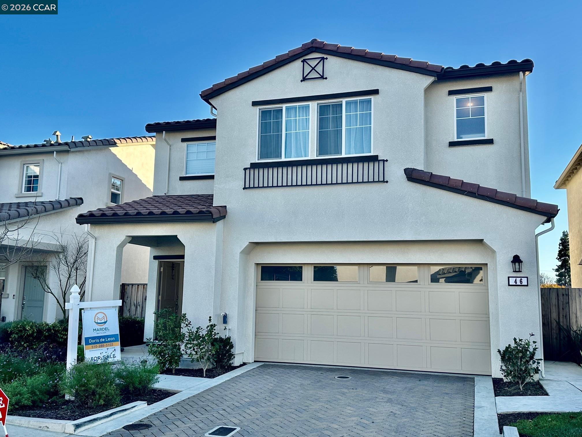 a front view of a house with a garage