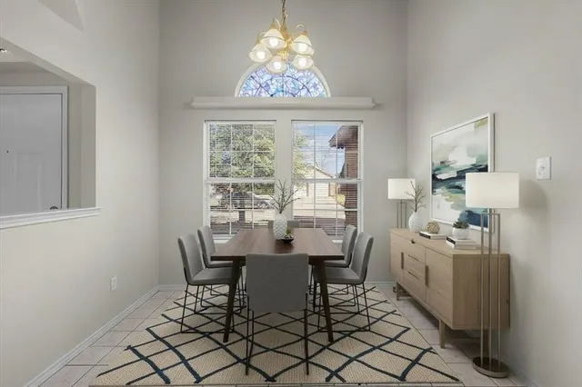 a dining room with furniture and window