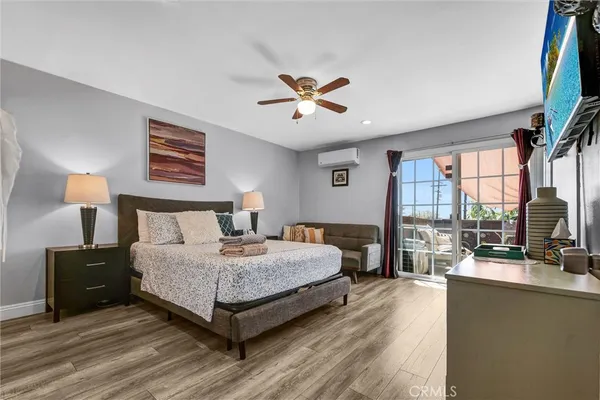a bedroom with a large bed and a large window