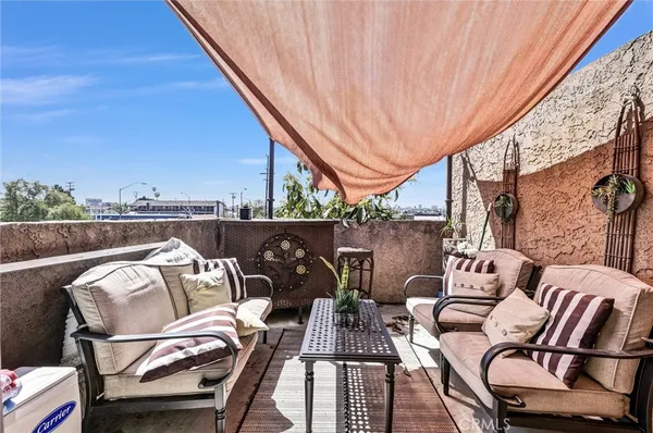 a view of a balcony with furniture