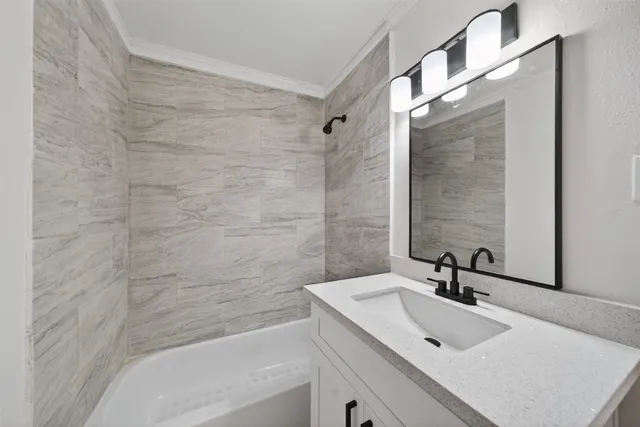 a bathroom with a sink and a bathtub