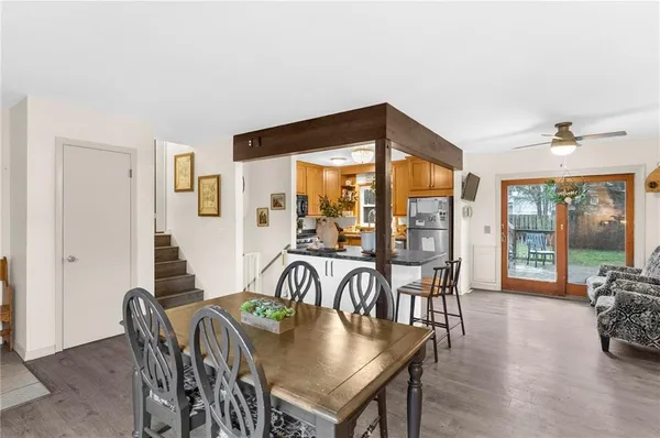 a view of a dining room with furniture window and outside view