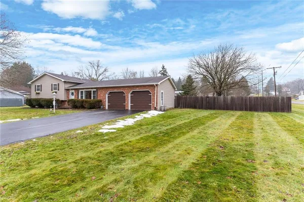 a view of house with yard