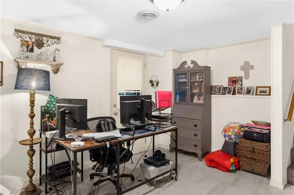 a view of a workspace with furniture and toys
