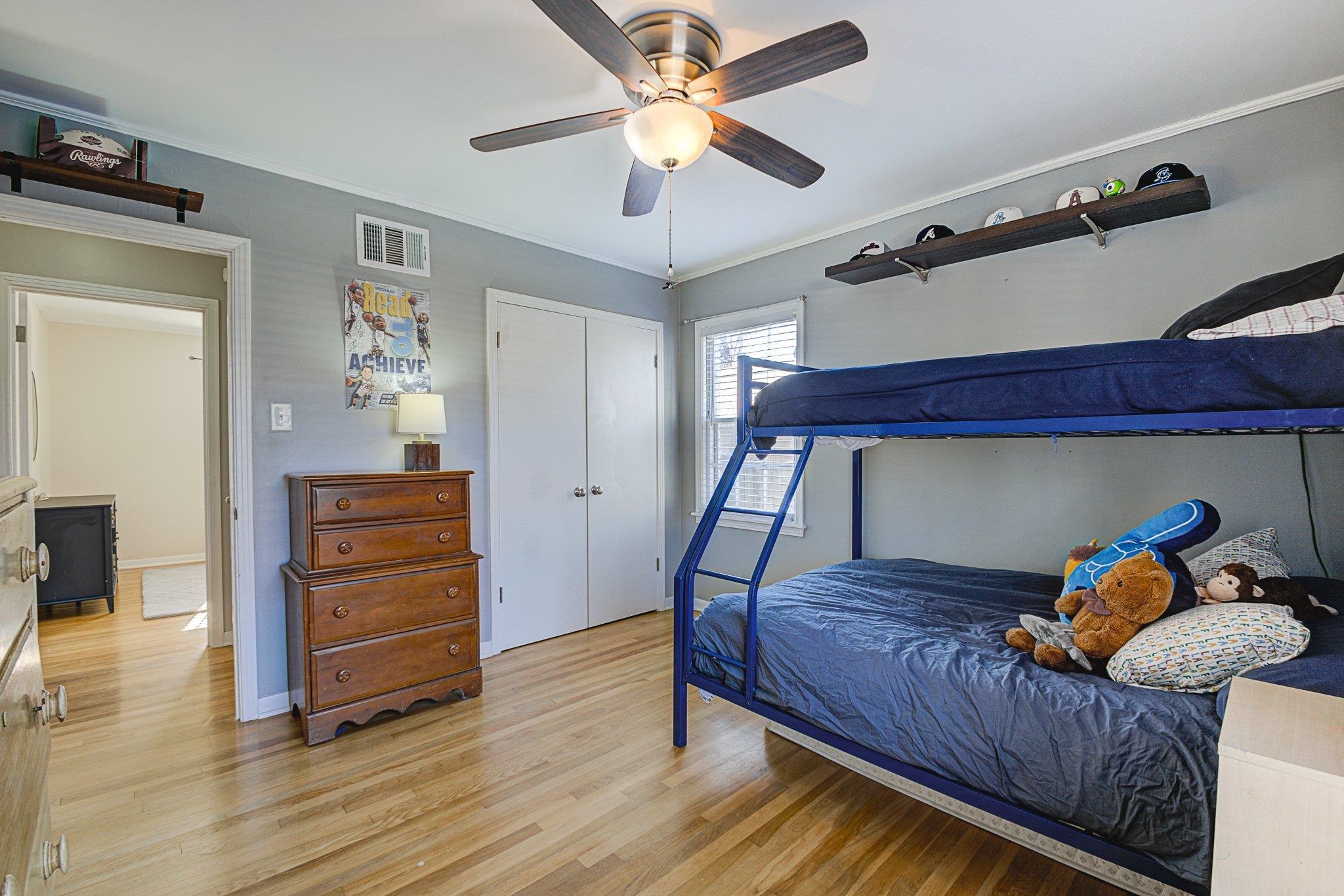 5661 Barfield Road Memphis, TN 38120 - Photo 21 of 31 Bedroom with a closet, ornamental molding, ceiling fan, and light hardwood / wood-style floors