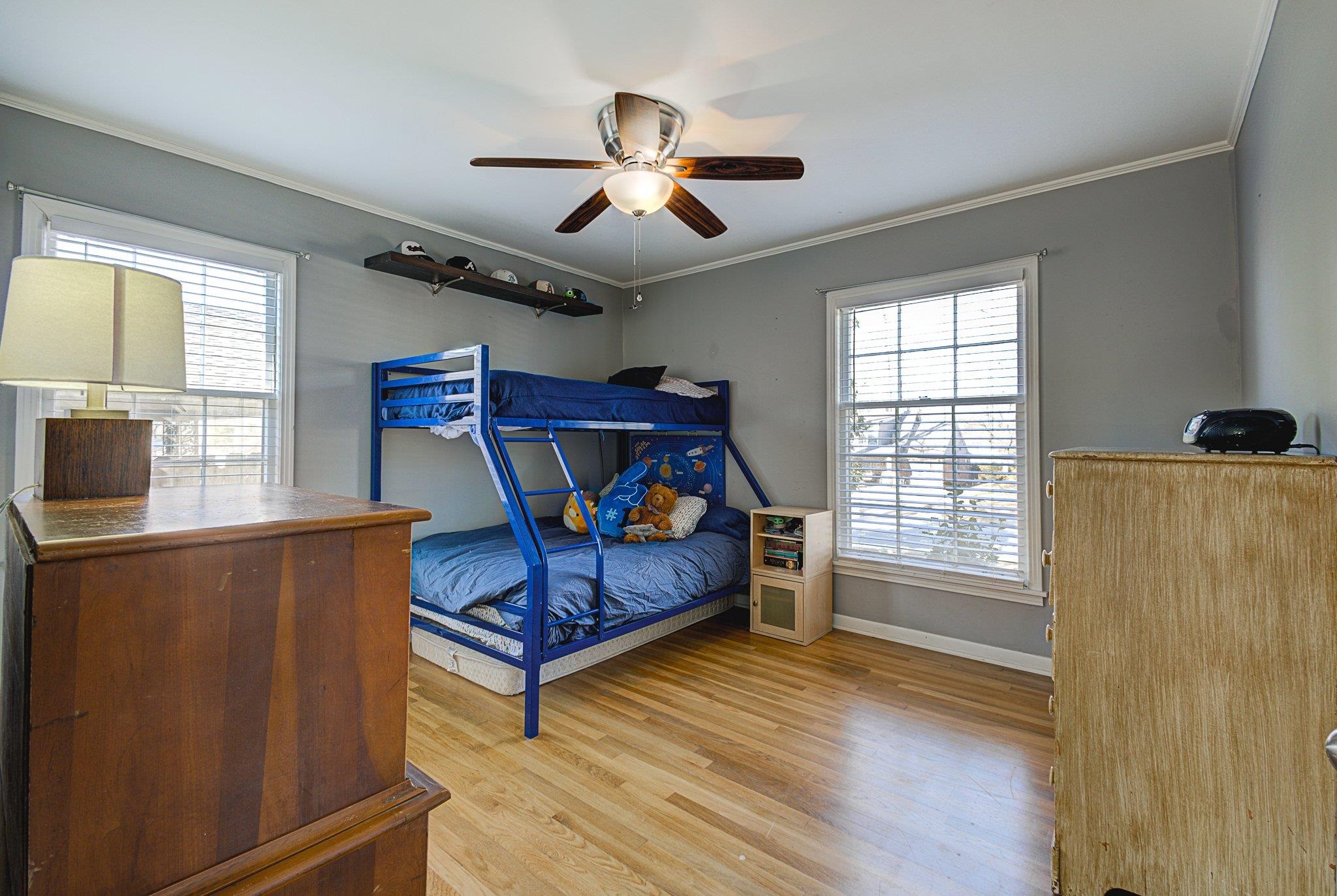 5661 Barfield Road Memphis, TN 38120 - Photo 22 of 31 Bedroom featuring ceiling fan, light hardwood / wood-style floors, and ornamental molding