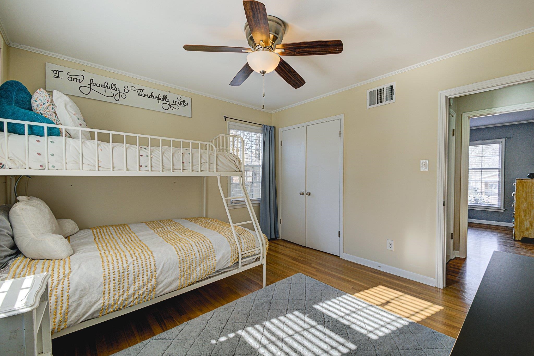 5661 Barfield Road Memphis, TN 38120 - Photo 24 of 31 Bedroom featuring hardwood / wood-style flooring, ceiling fan, crown molding, and multiple windows