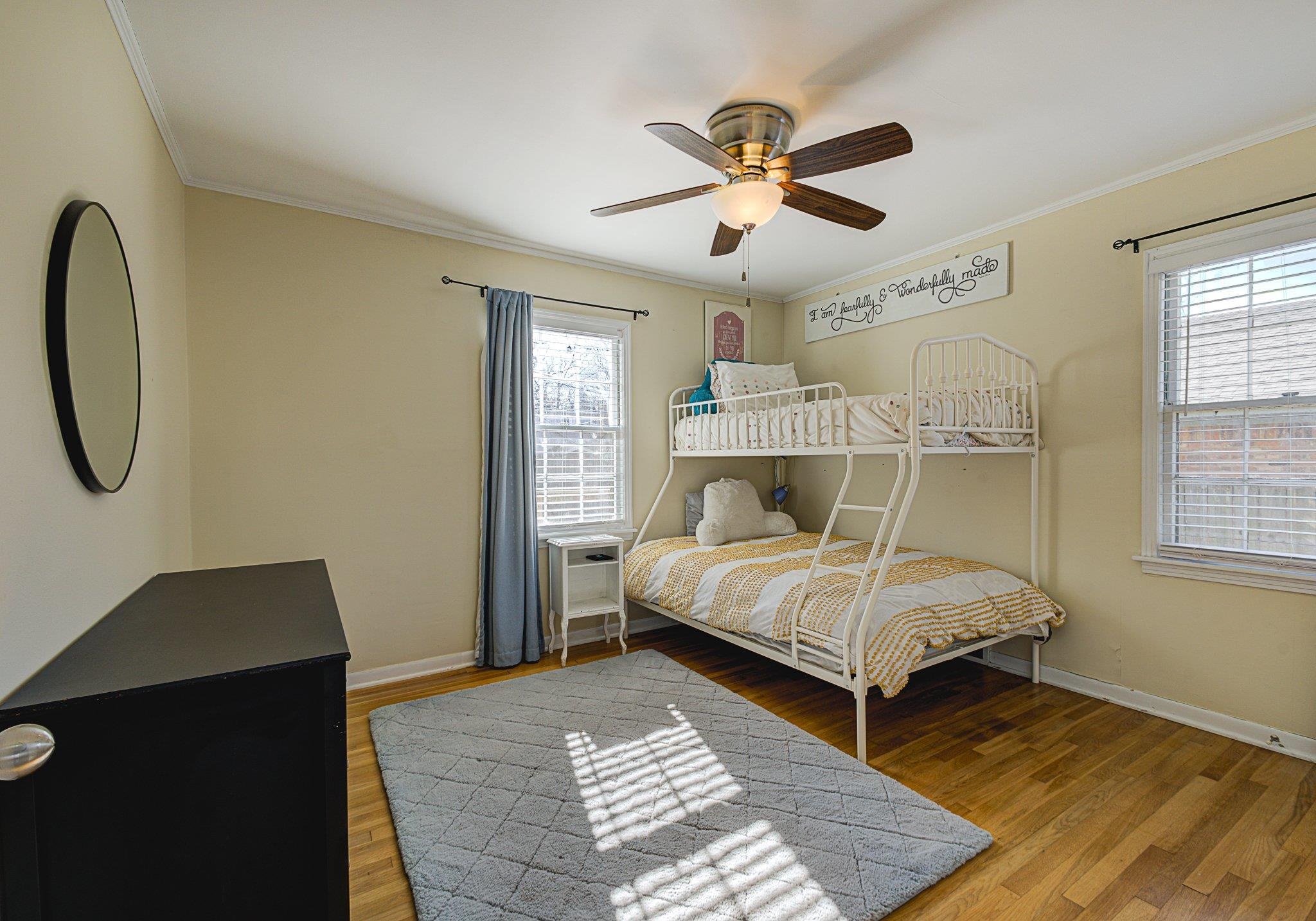 5661 Barfield Road Memphis, TN 38120 - Photo 25 of 31 Bedroom with ceiling fan, crown molding, and wood-type flooring