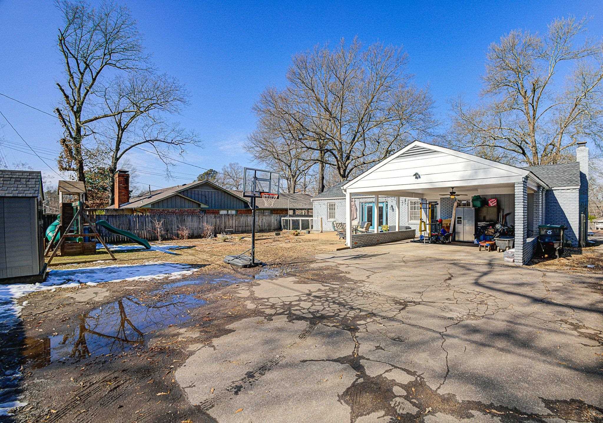 5661 Barfield Road Memphis, TN 38120 - Photo 28 of 31 View of yard with an outbuilding and a playground