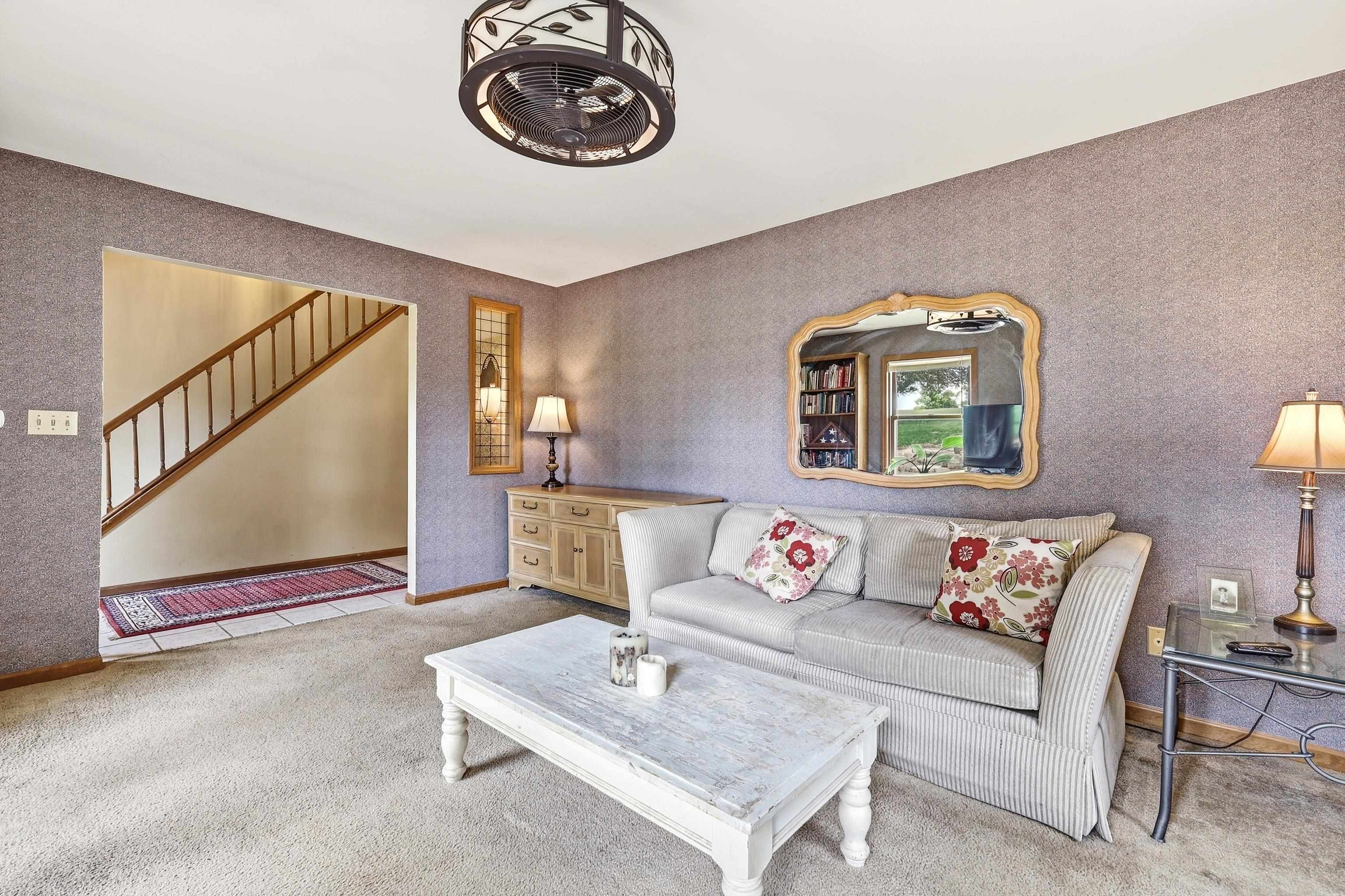 13 Signal Point Lane Galena, IL 61036 - Photo 6 of 47 a living room with furniture and a wall painting