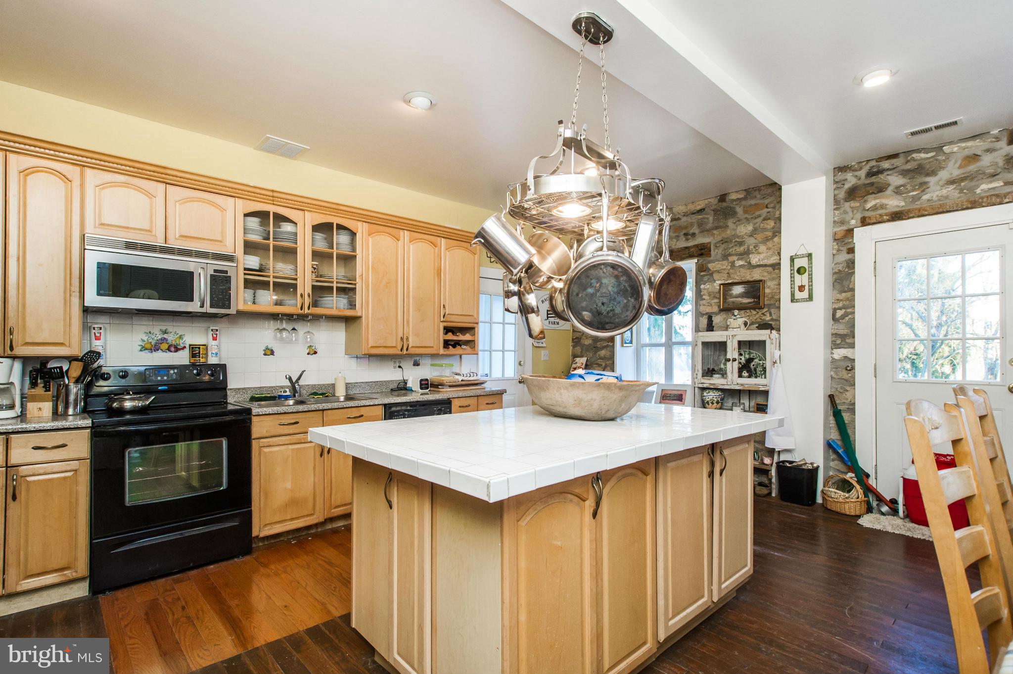 16300 Cedar Grove Road Sparks Glencoe, MD 21152 - Photo 15 of 28 a kitchen with a sink stove and microwave