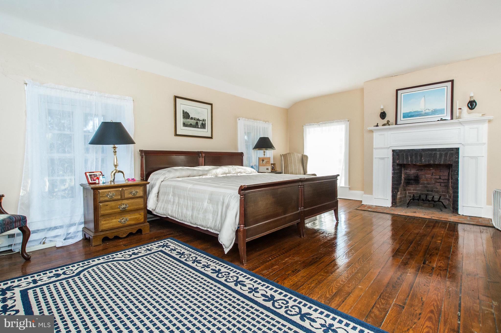 16300 Cedar Grove Road Sparks Glencoe, MD 21152 - Photo 18 of 28 a bedroom with a bed and a fireplace