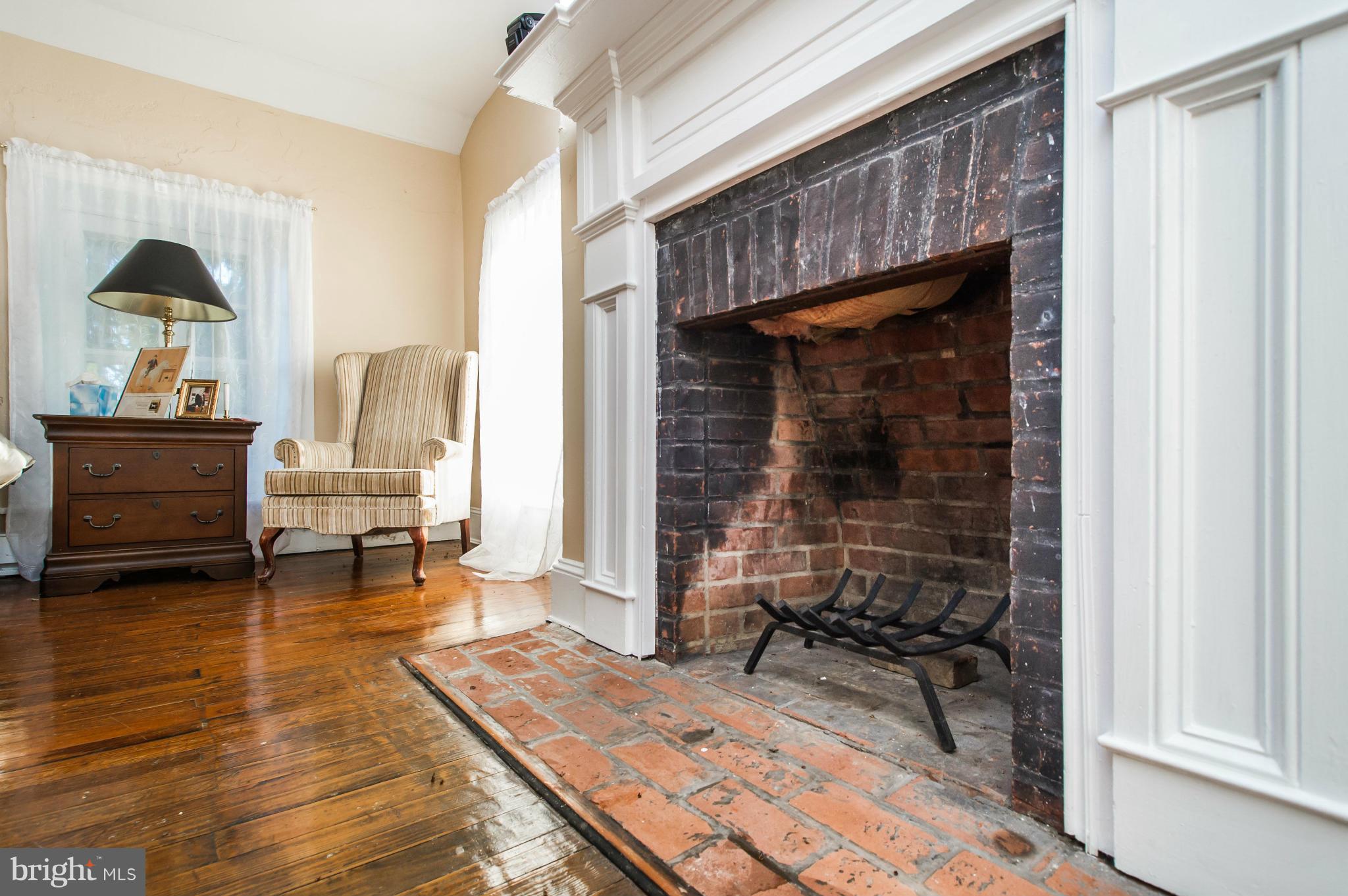 16300 Cedar Grove Road Sparks Glencoe, MD 21152 - Photo 19 of 28 a living room with furniture and a fireplace