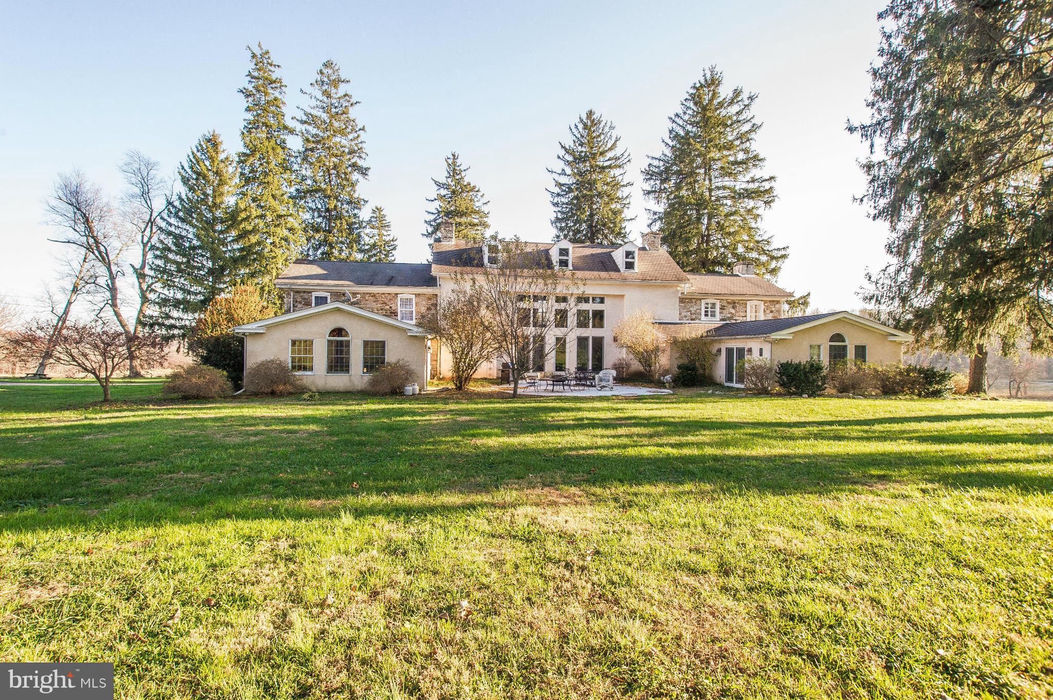 16300 Cedar Grove Road Sparks Glencoe, MD 21152 - Photo 20 of 28 a front view of a house with a yard table and chairs