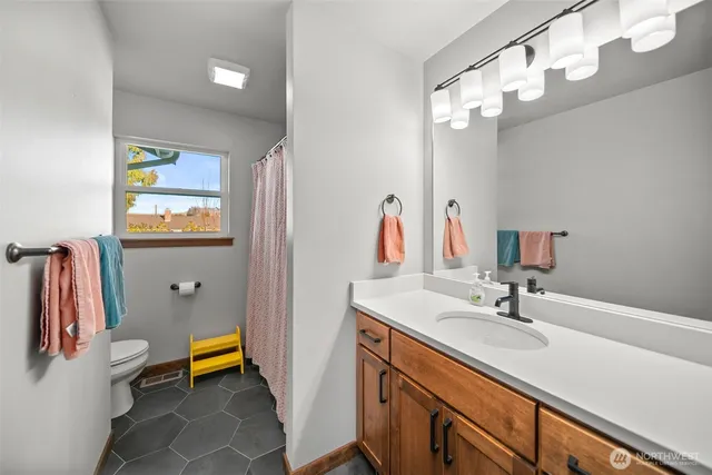a bathroom with a sink double vanity and a mirror