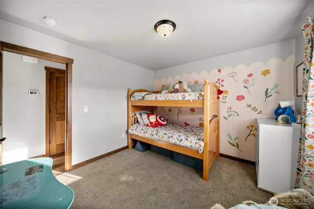 a bedroom with a bed and a couch