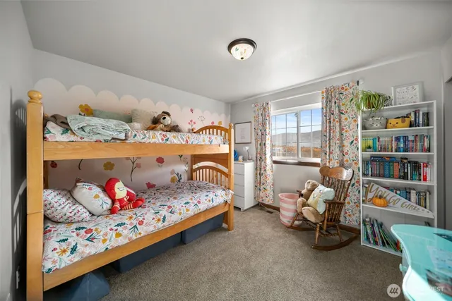 a bedroom with bed and a window