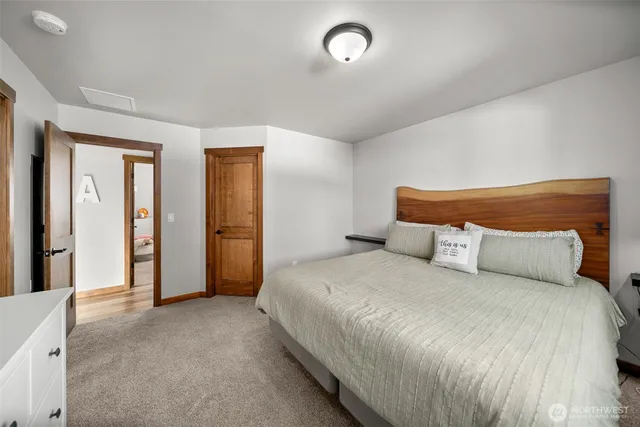 a bedroom with a bed and closet