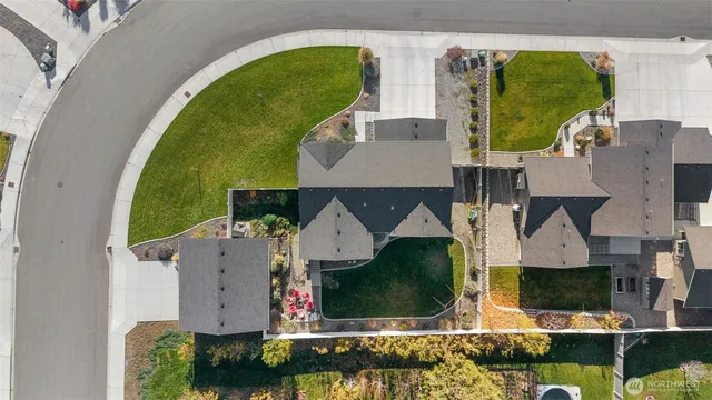 an aerial view of a house with swimming pool