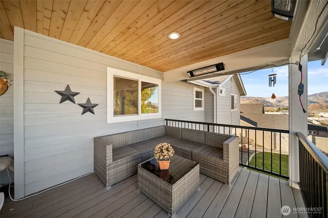 a view of a balcony with furniture