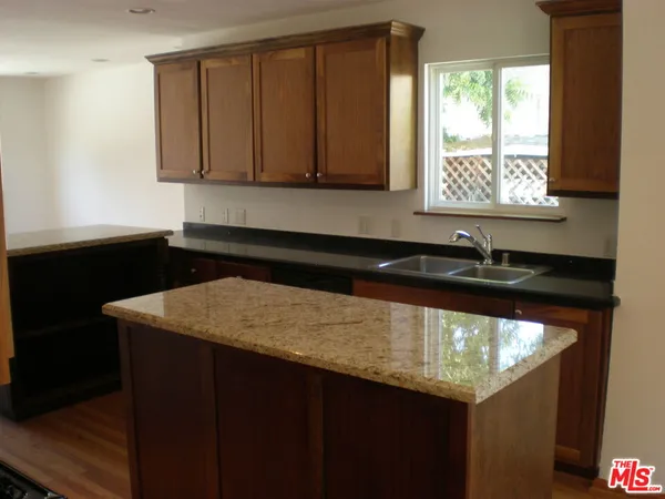 a kitchen with a sink and a window