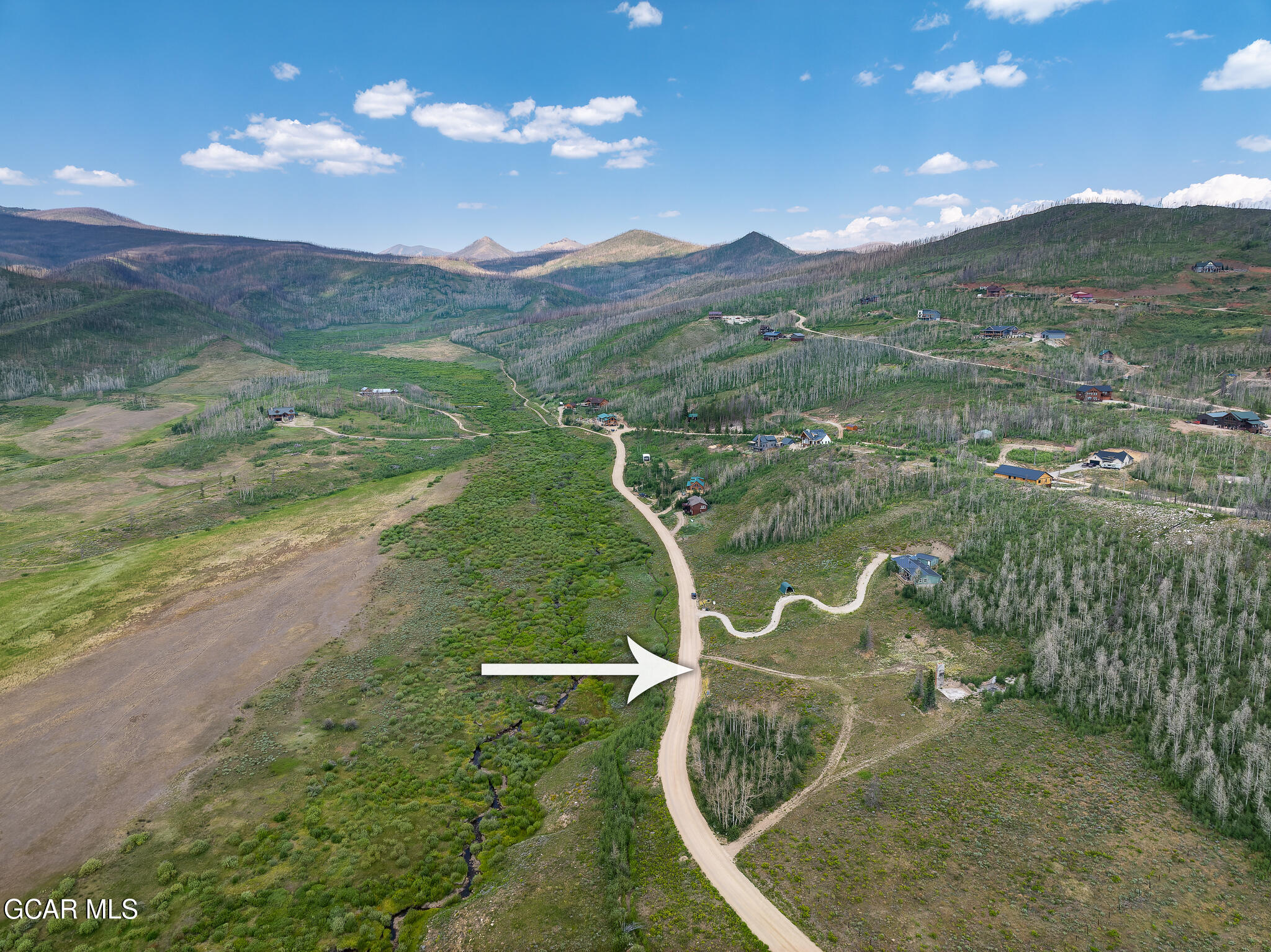 a view of a lake in middle of the town