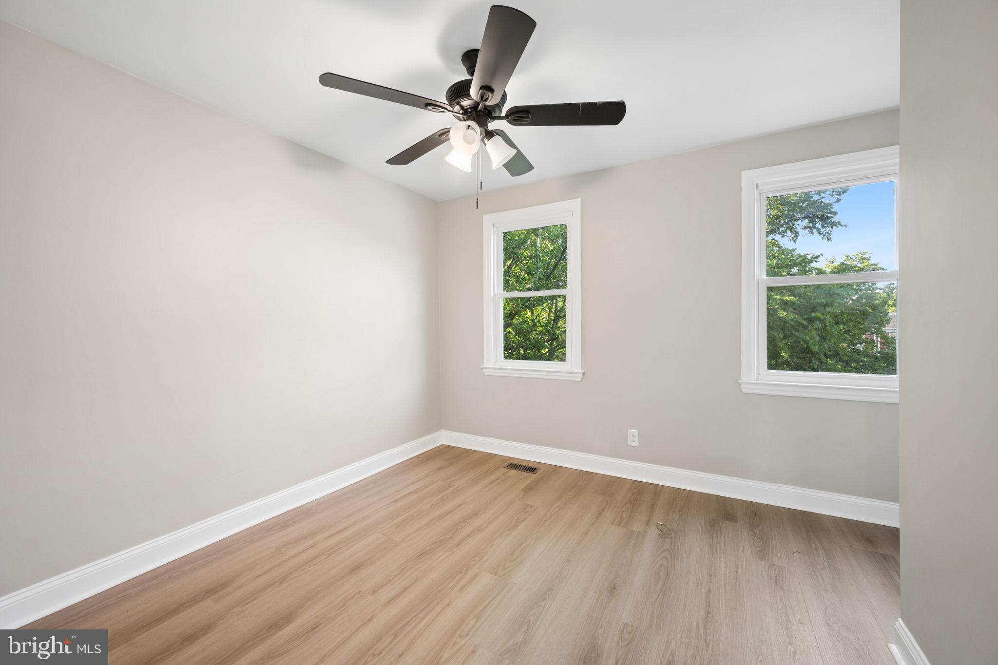 3548 Benzinger Road Baltimore, MD 21229 - Photo 21 of 40 wooden floor in an empty room with a window